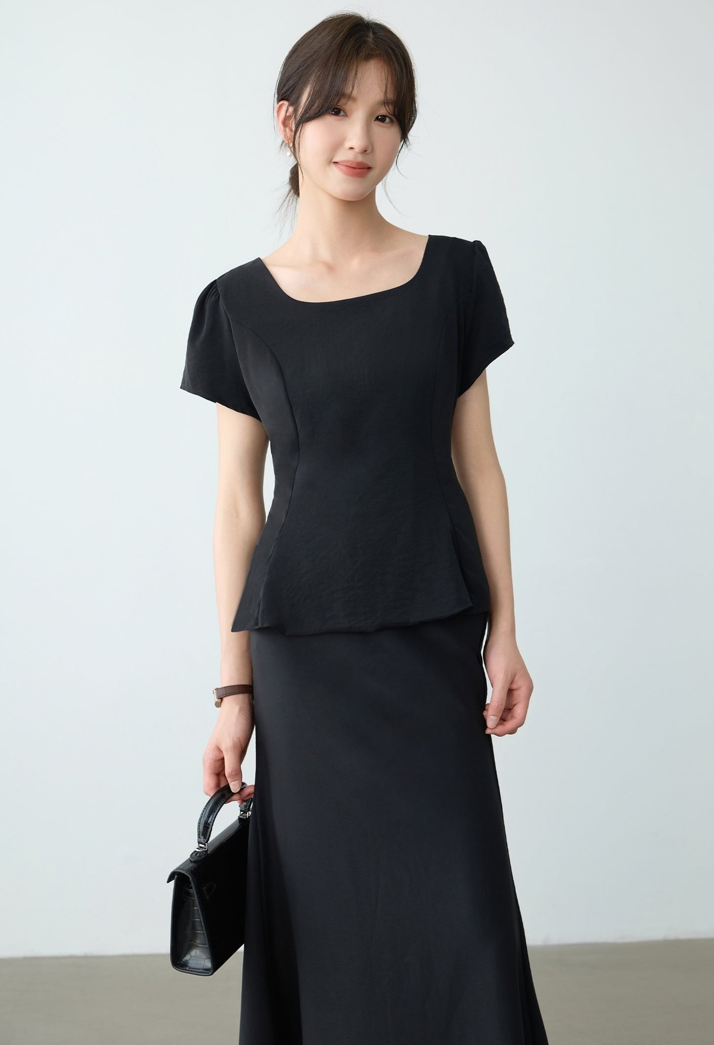 Elegant Black Peplum Top and Maxi Skirt Set