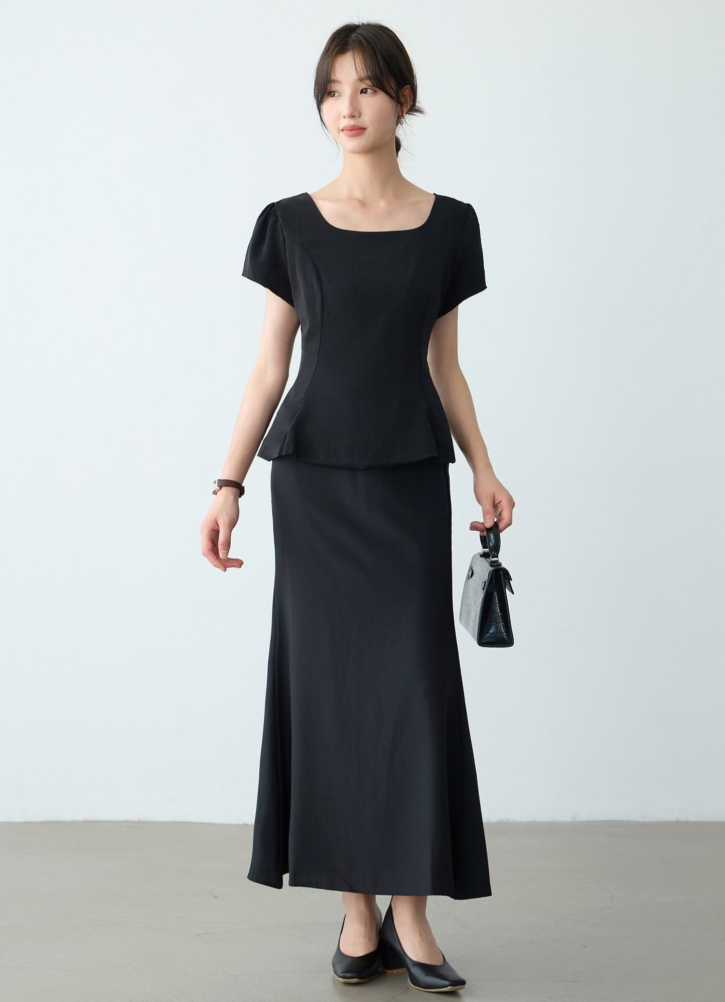 Elegant Black Peplum Top and Maxi Skirt Set