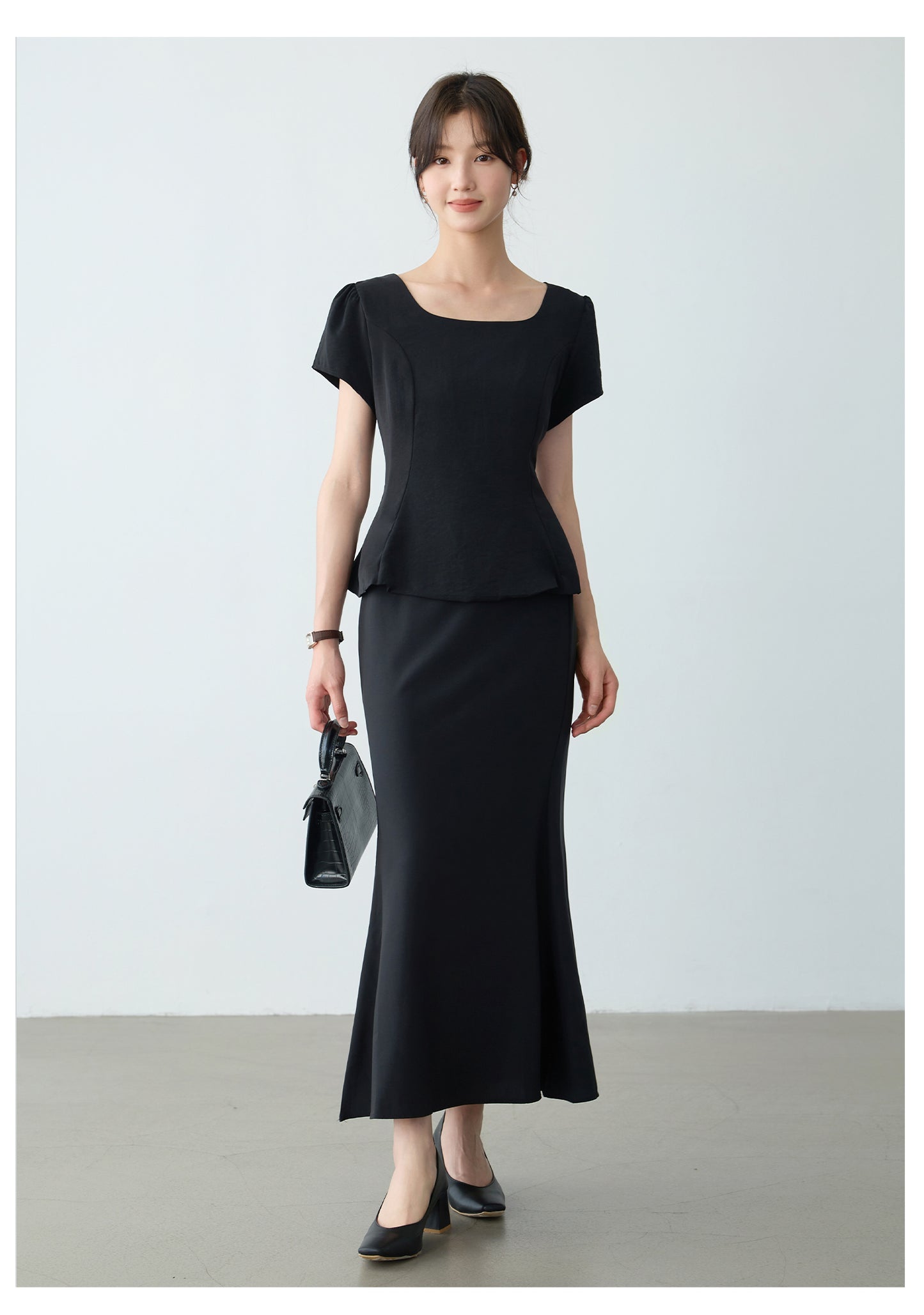Elegant Black Peplum Top and Maxi Skirt Set