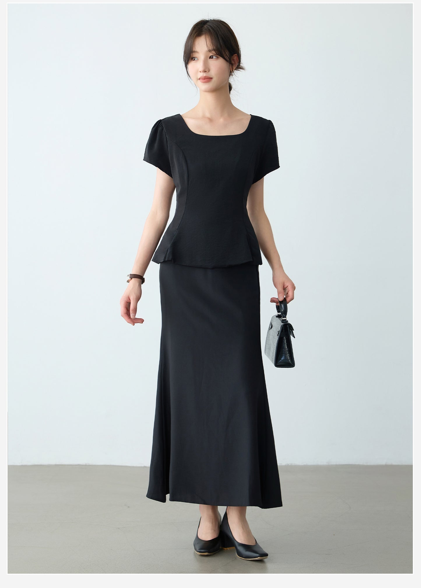Elegant Black Peplum Top and Maxi Skirt Set