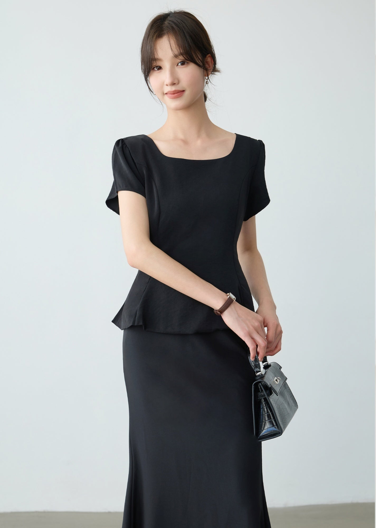 Elegant Black Peplum Top and Maxi Skirt Set